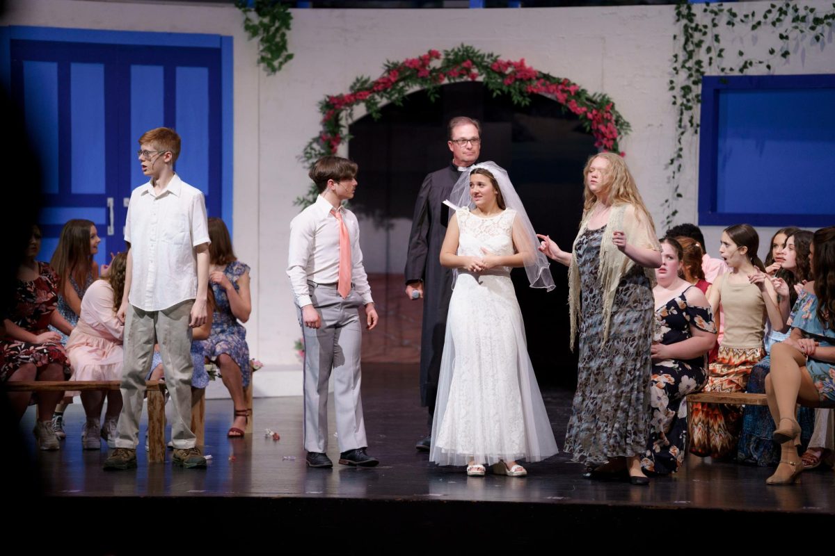 Junior William Scott (center) performs during the fall production of Mama Mia. 