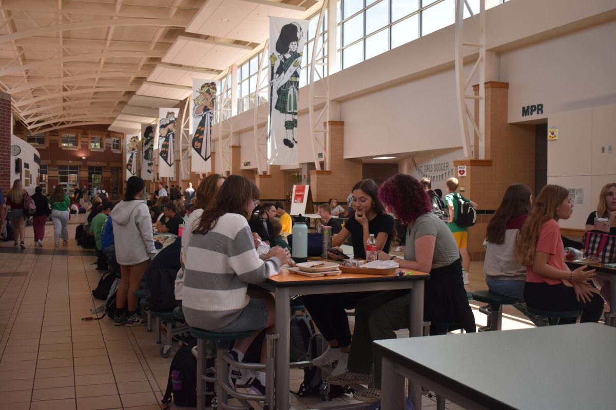 Students eat lunch at one of the tables in the spine. Additional tables were added in recent years to provide additional seating space as the cafeteria became overcrowded. 