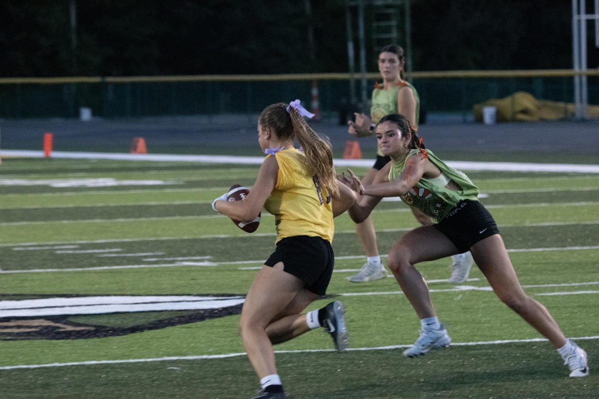 Amelia Kaml runs against the defense,