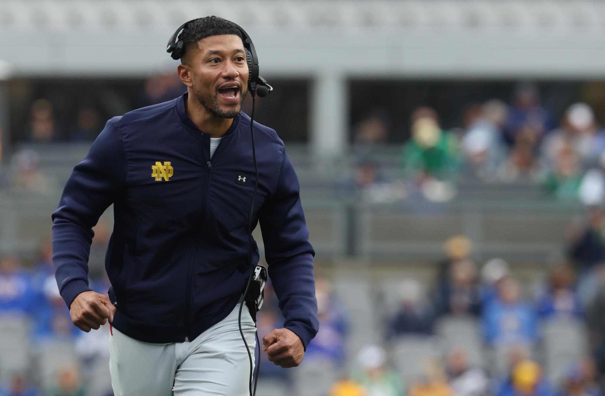 Nov 15, 2025; Pittsburgh, Pennsylvania, USA;  Notre Dame Fighting Irish head coach Marcus Freeman reacts after an Irish touchdown against the Pittsburgh Panthers during the second quarter at Acrisure Stadium. Mandatory Credit: Charles LeClaire-Imagn Images