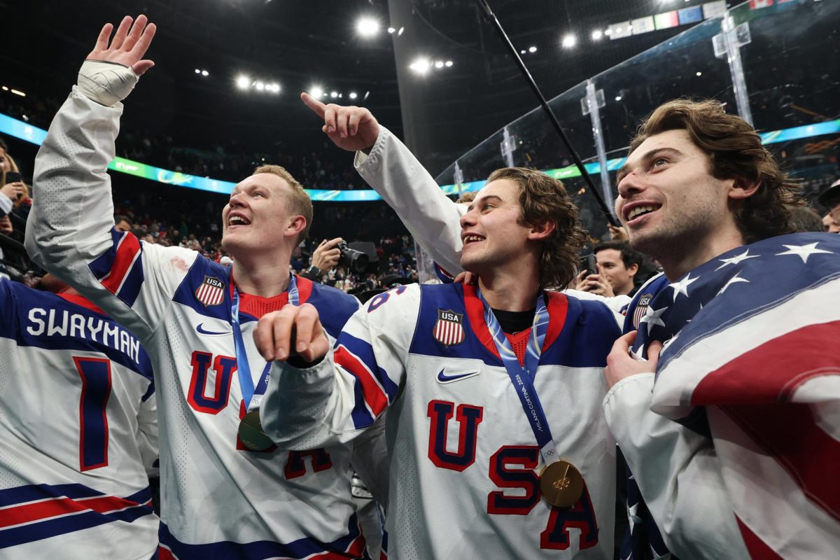 Milano Cortina 2026 Olympics - Ice Hockey - Men's Victory Ceremony - Milano Santagiulia Ice Hockey Arena, Milan, Italy - February 22, 2026. Gold medallists Brady Tkachuk of United States, Jack Hughes of United States and Quinn Hughes of United States celebrate during the victory ceremony REUTERS/Mike Segar