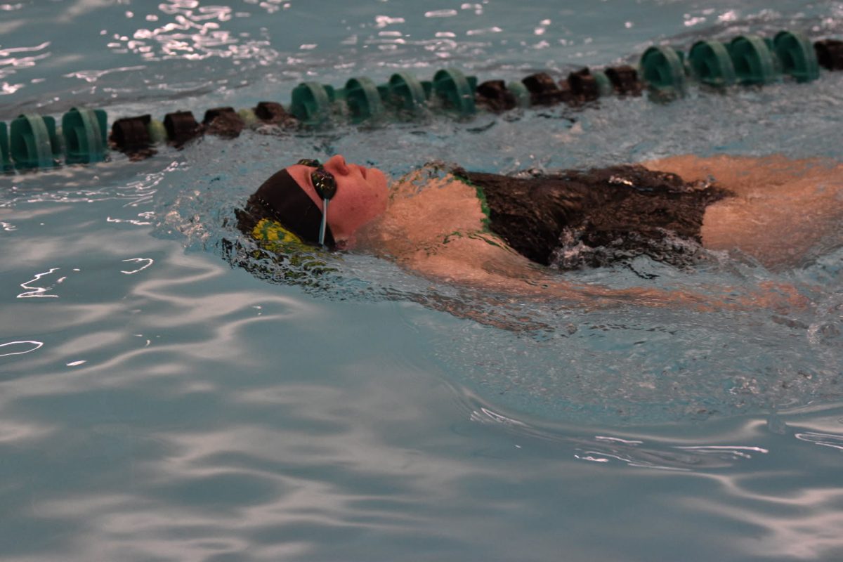 Senior Brooke Bielefeld practices backstrokes before an upcoming competition.