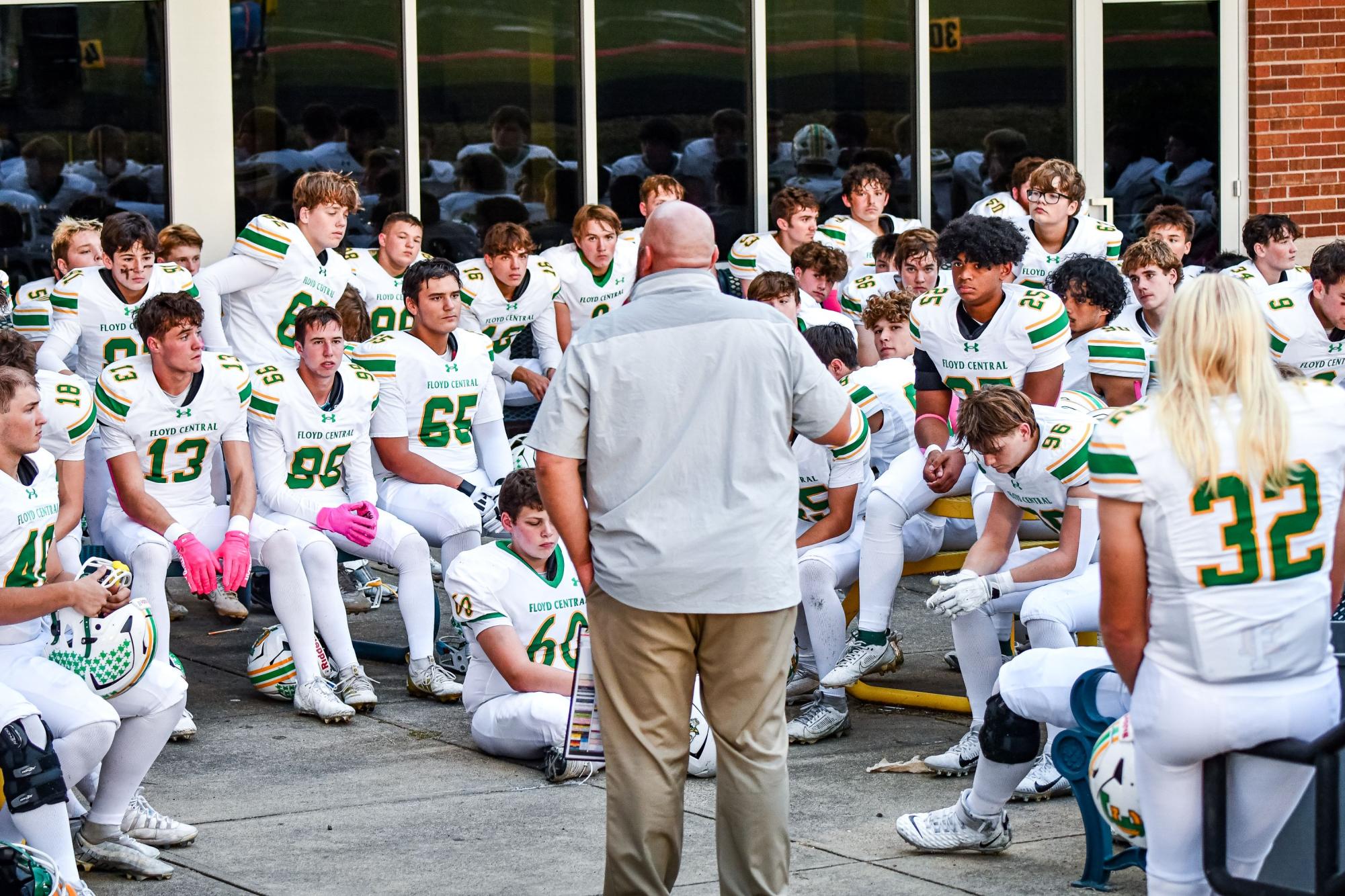 Coach James Bragg talks to the varsity football team before the Oct. 17, 2025 game against New Albany. The Highlanders beat the Bulldogs 42-6. 