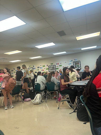 Various Fellowship of Christian Athlete attendees prepare to leave a Tuesday meeting. The mood was light after they concluded their group prayer.